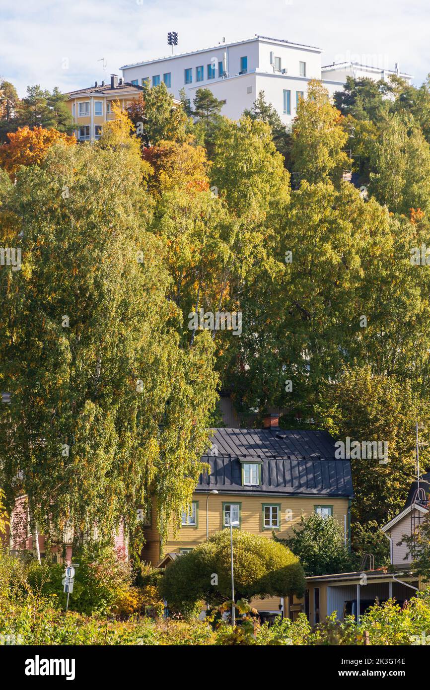 Autumnla foliage on Pispala ridge with renovated Pispala School on top in Tampere Finland Stock Photo