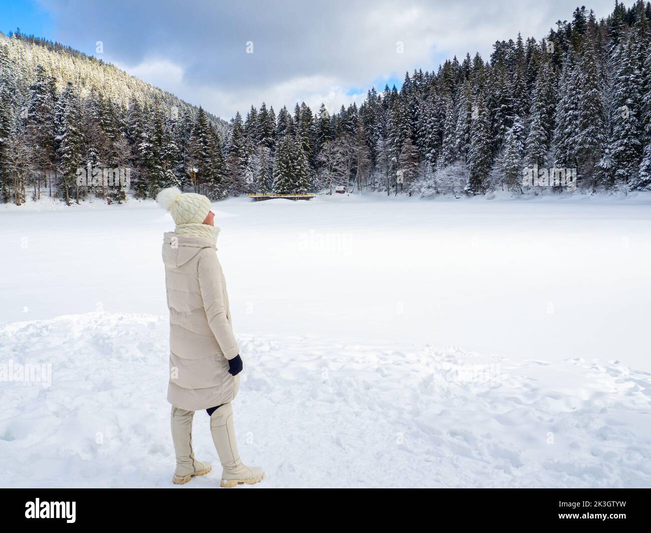 Woman back view by water in winter hi-res stock photography and images ...
