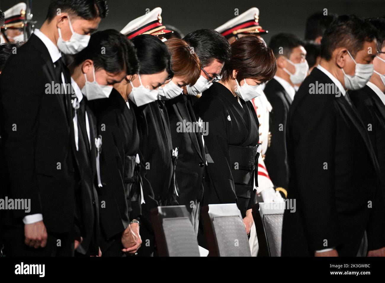 The widow of former Japanese prime minister Shinzo Abe, Akie Abe (centre R), bows her head with others for a moment of silence during his state funeral at the Nippon Budokan in Tokyo on September 27, 2022. PHILIP FONG/Pool via REUTERS Stock Photo