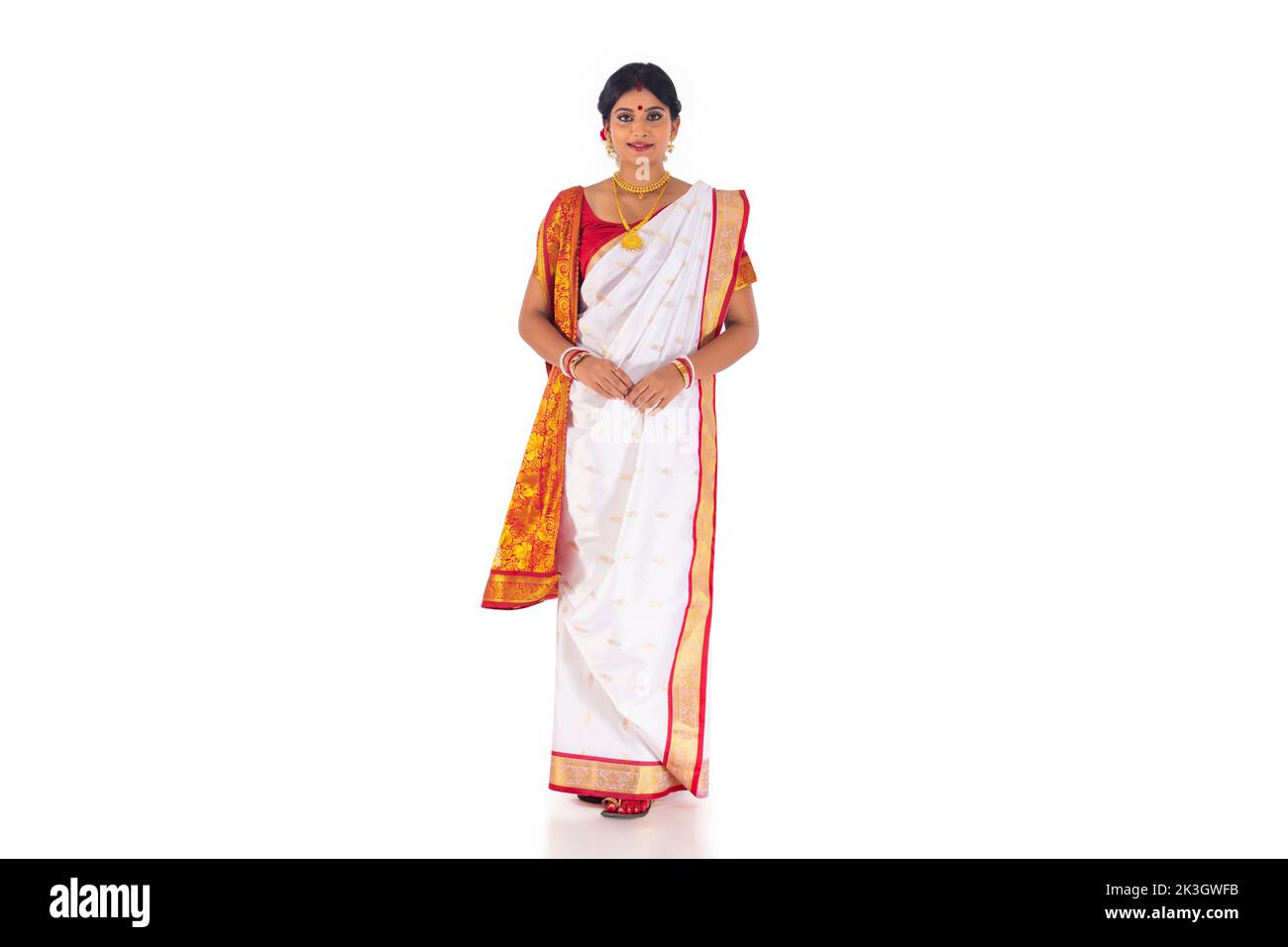 Portrait of Bengali woman in tradition clothing against white