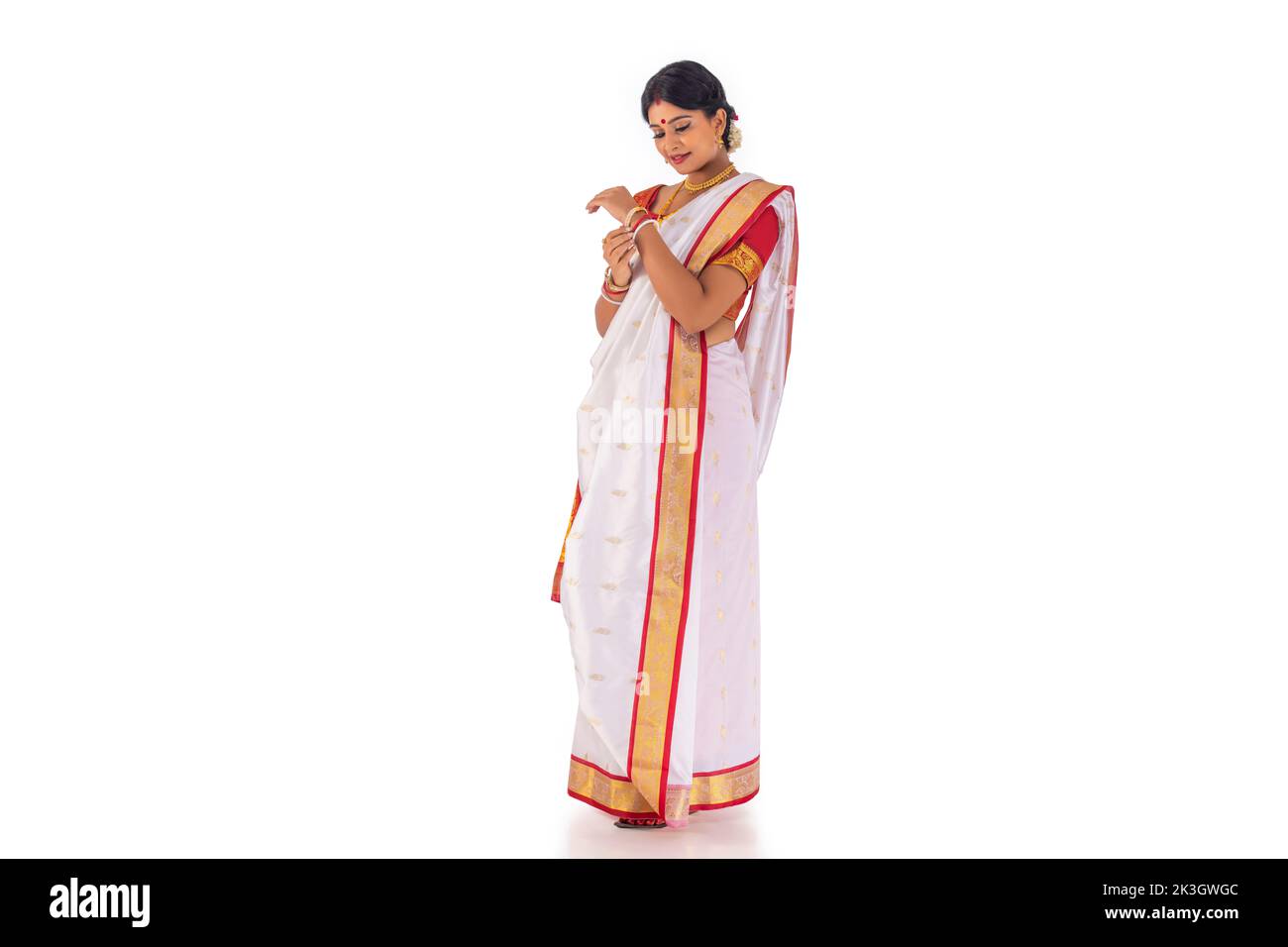Portrait of Bengali woman in tradition clothing against white