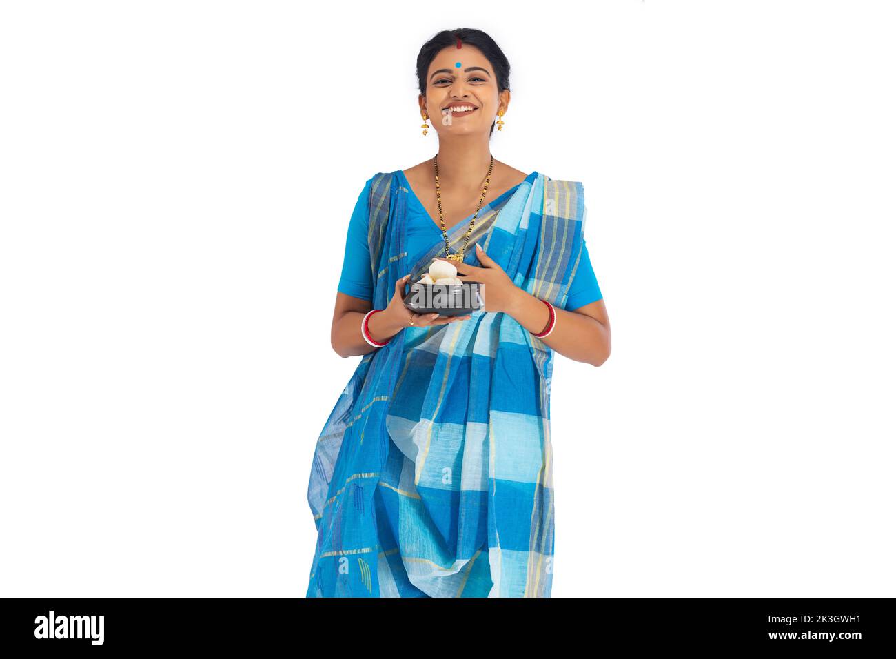 Portrait of Bengali woman standing with a rosogolla handi Stock Photo