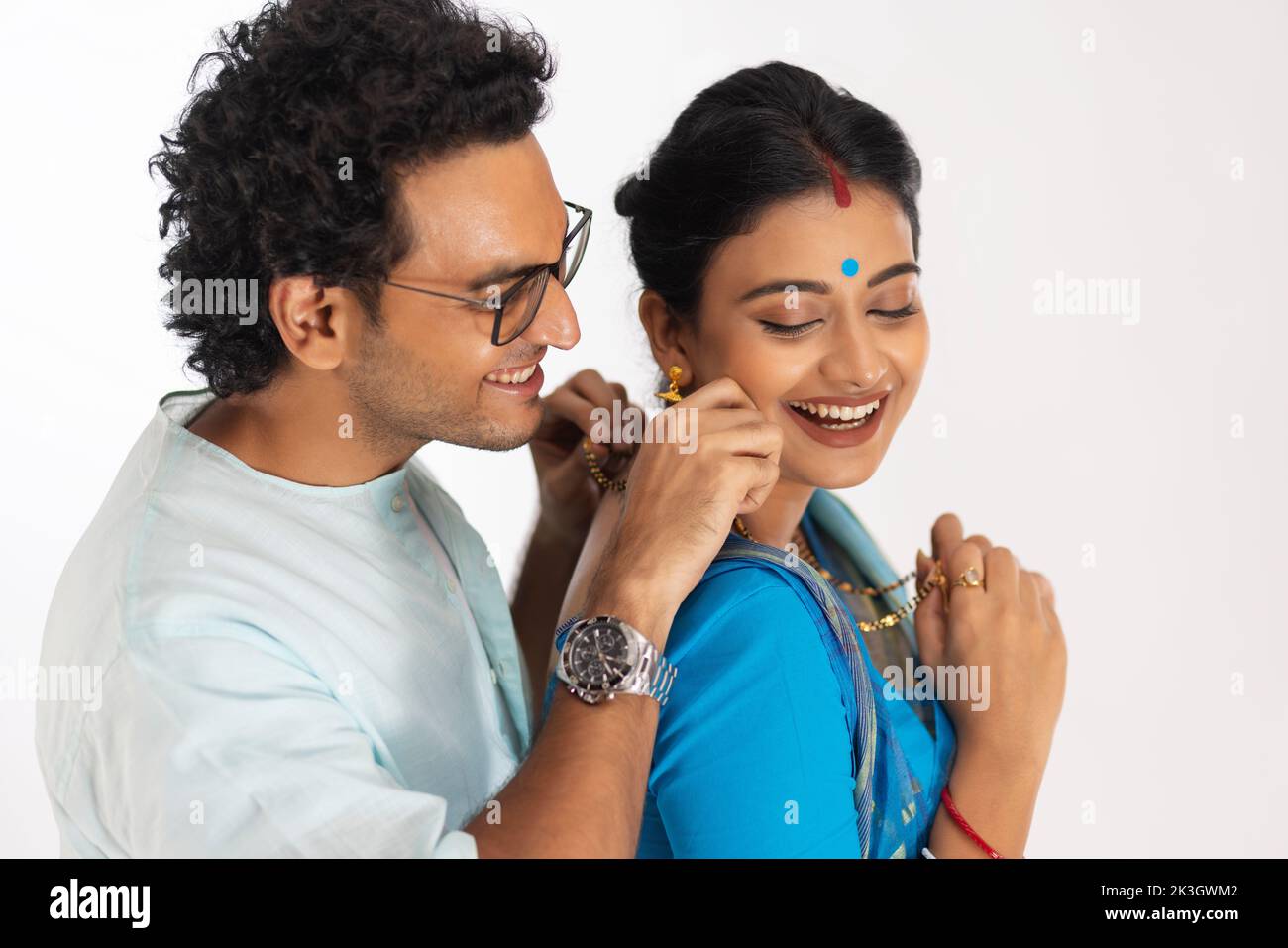 Loving husband wearing mangalsutra to his wife Stock Photo