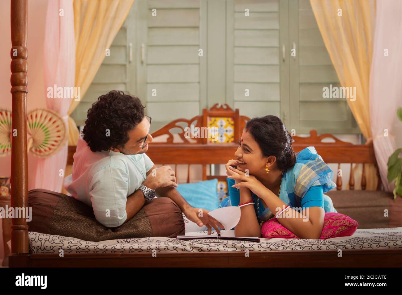 Portrait of Bengali couple lying on bed Stock Photo Alamy