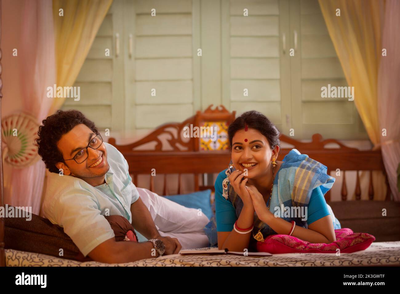 Portrait of Bengali couple lying on bed Stock Photo Alamy