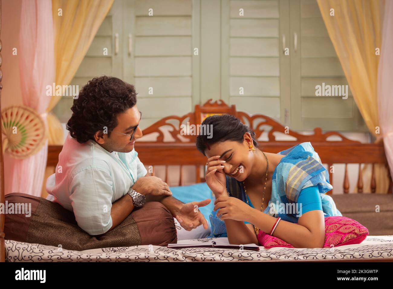 Portrait of Bengali couple lying on bed Stock Photo Alamy
