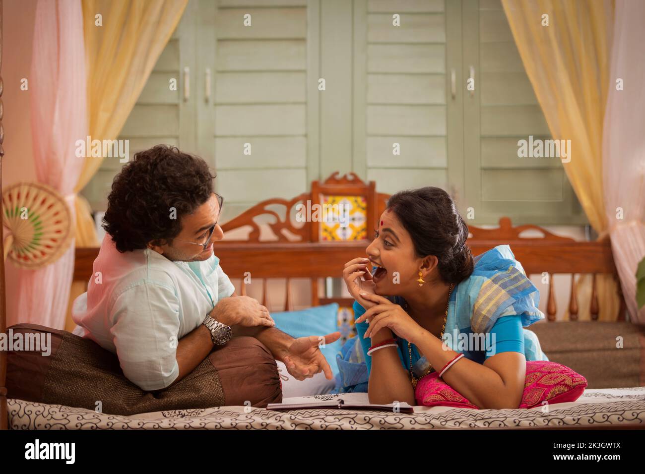 Portrait of Bengali couple lying on bed Stock Photo Alamy