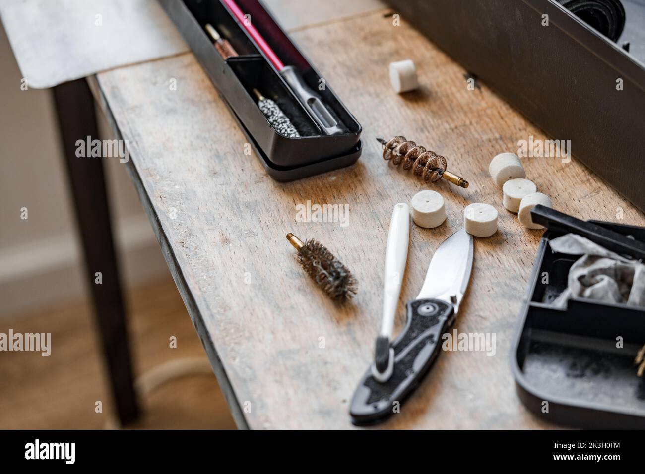 Set of tools for cleaning and repairing weapons in workshop Stock Photo ...