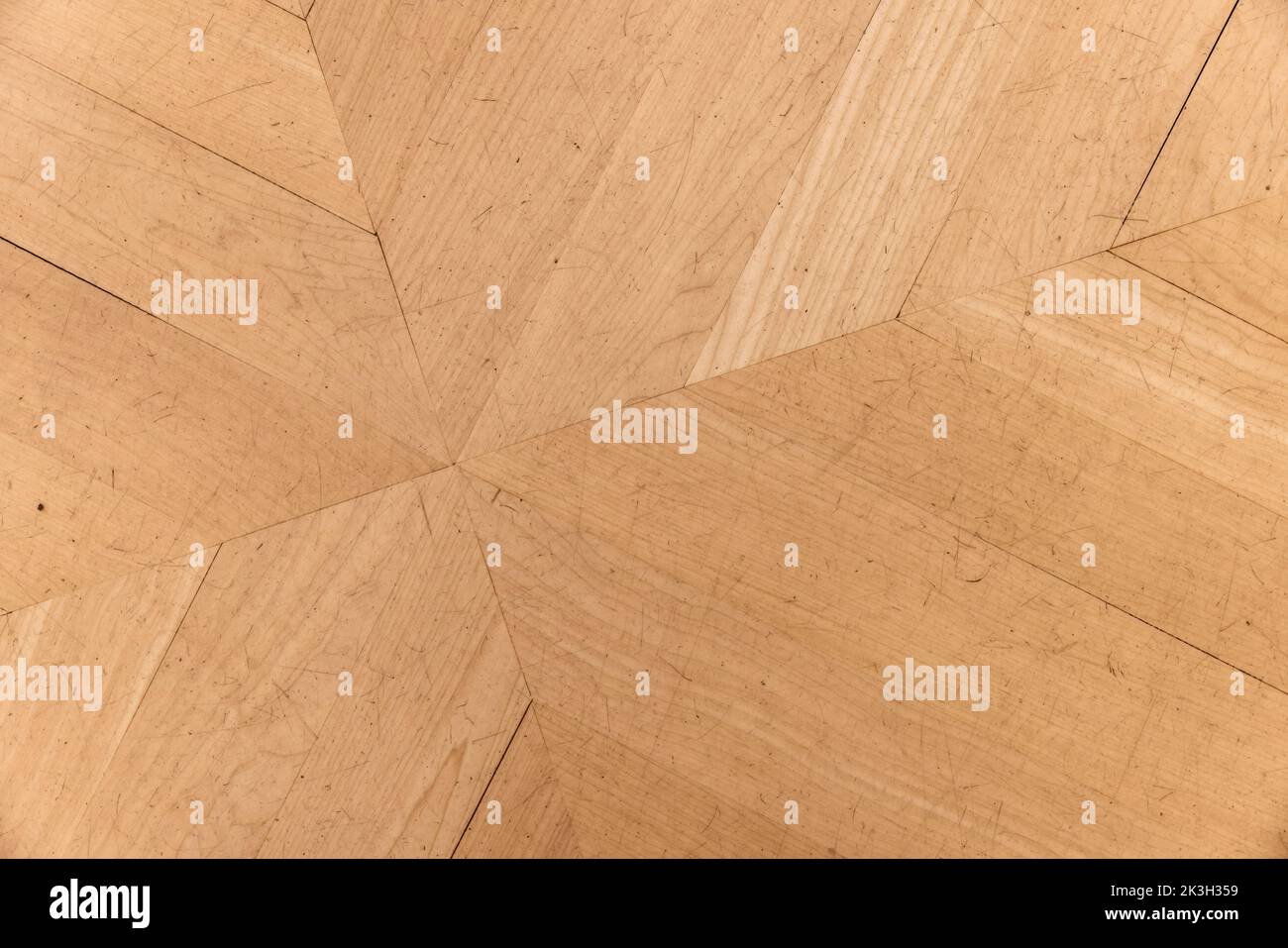 Old parquet made of oak wood planks with geometric pattern, decorative tiling. Background photo texture Stock Photo