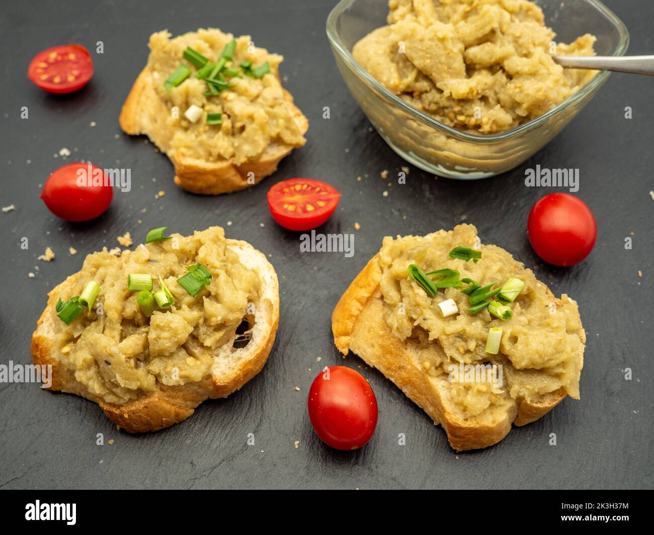 appetizer romanian eggplant salad with onion and tomatoes spread on bread Stock Photo