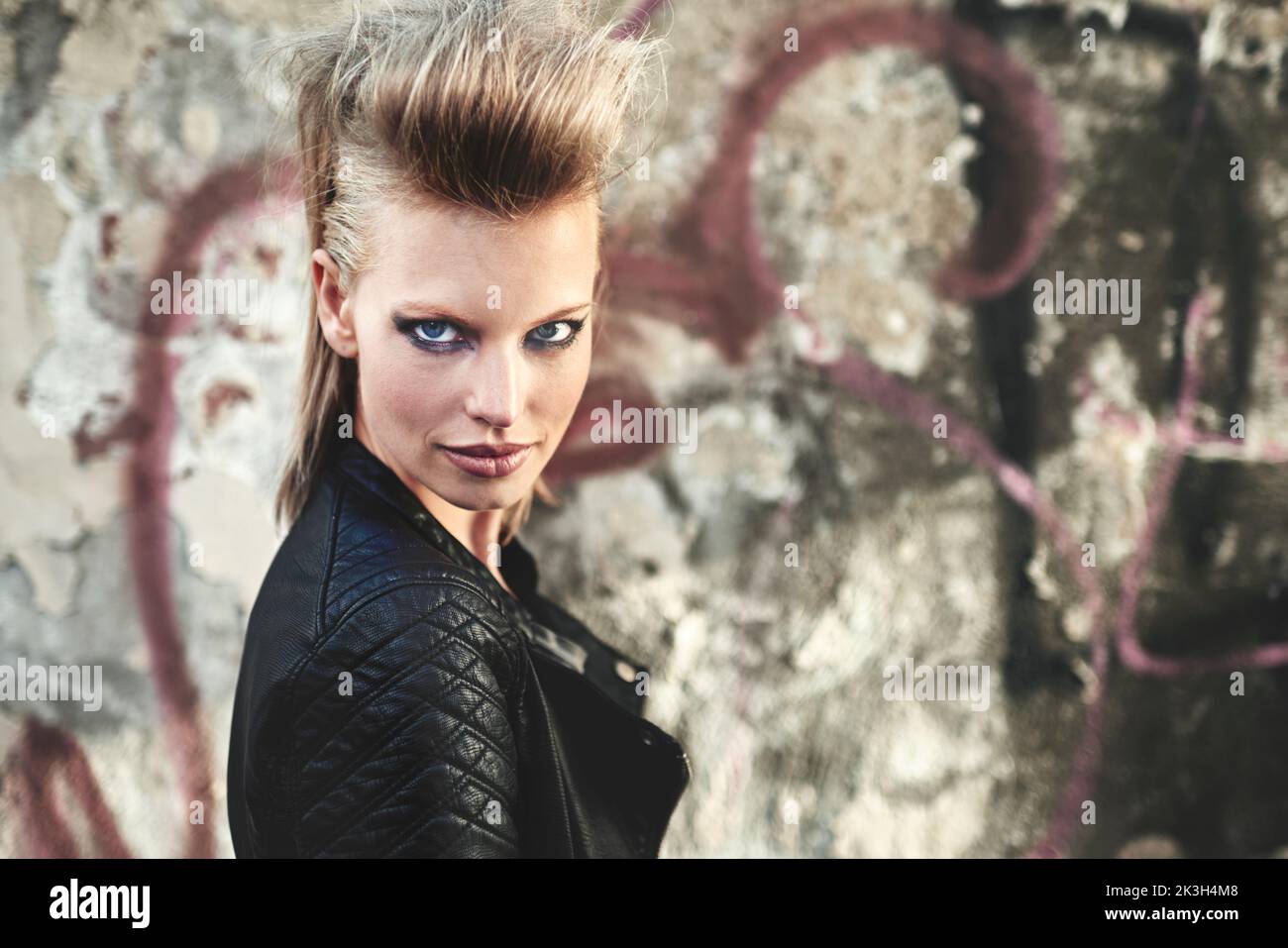 Im so rock n roll. Cropped portrait of an edgy young woman in an urban setting. Stock Photo
