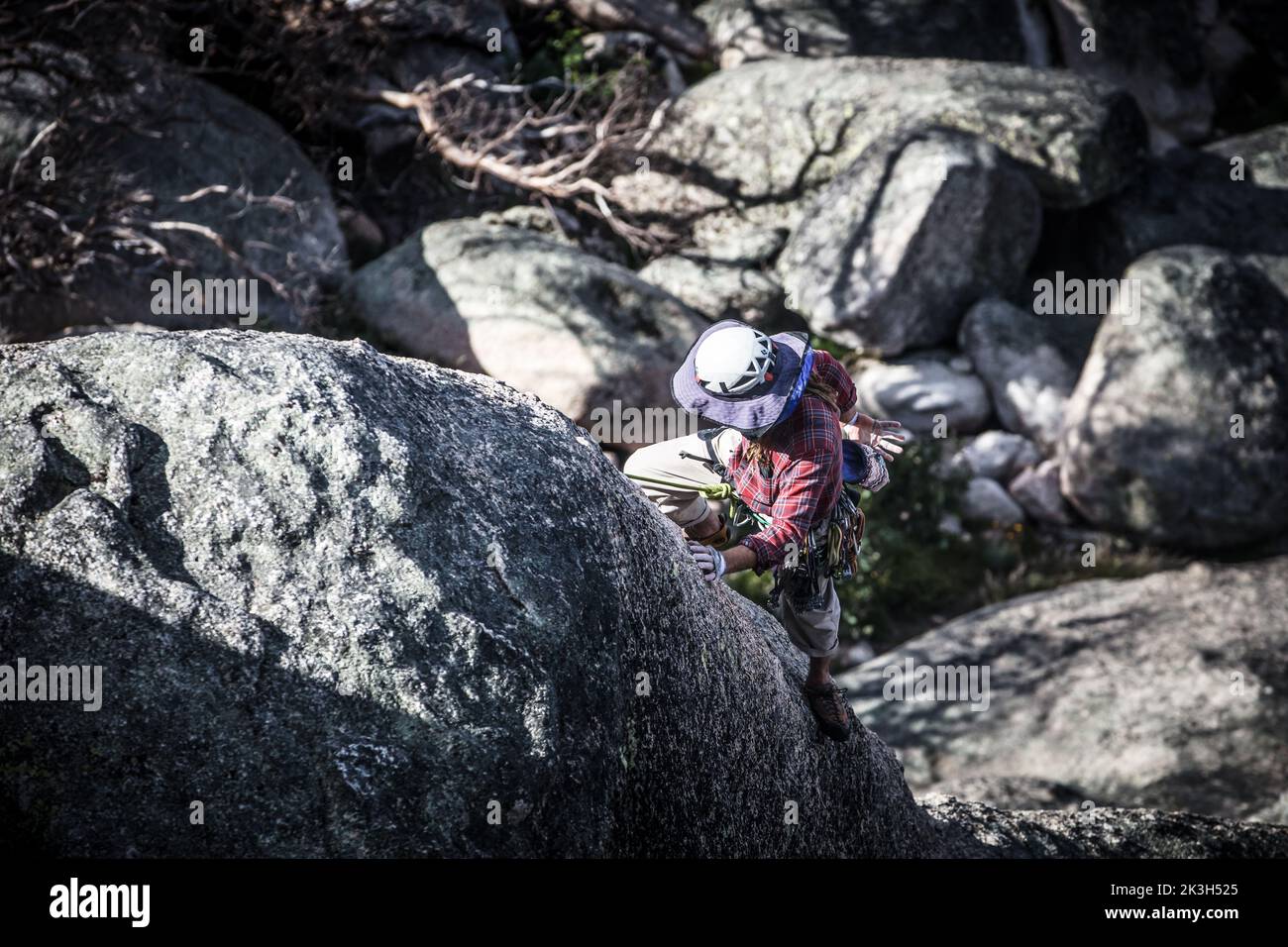 Rock Incline A rock climber tackles a steep incline on Mt Buffalo on a summer's ...