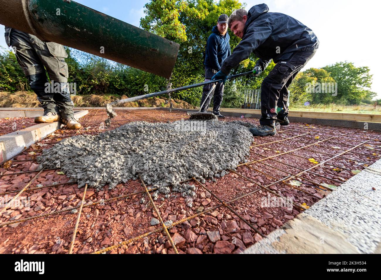 Early morning concrete pouring of a stable block slab. Seen as lacking "green" credentials, a