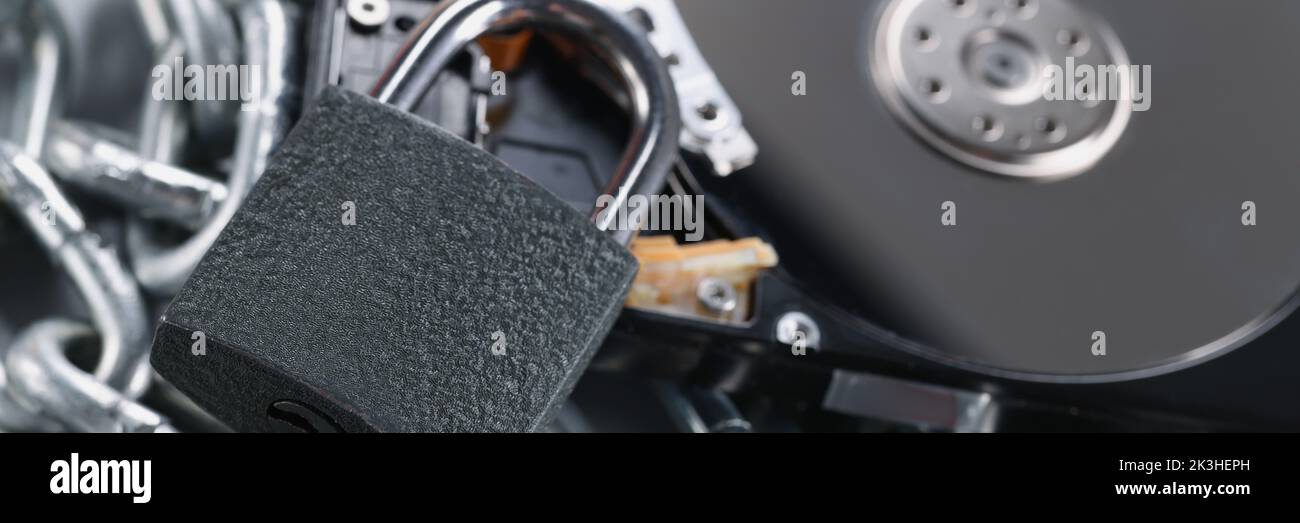 Data on cd rom secured with chain and padlock equipment, key hole Stock Photo
