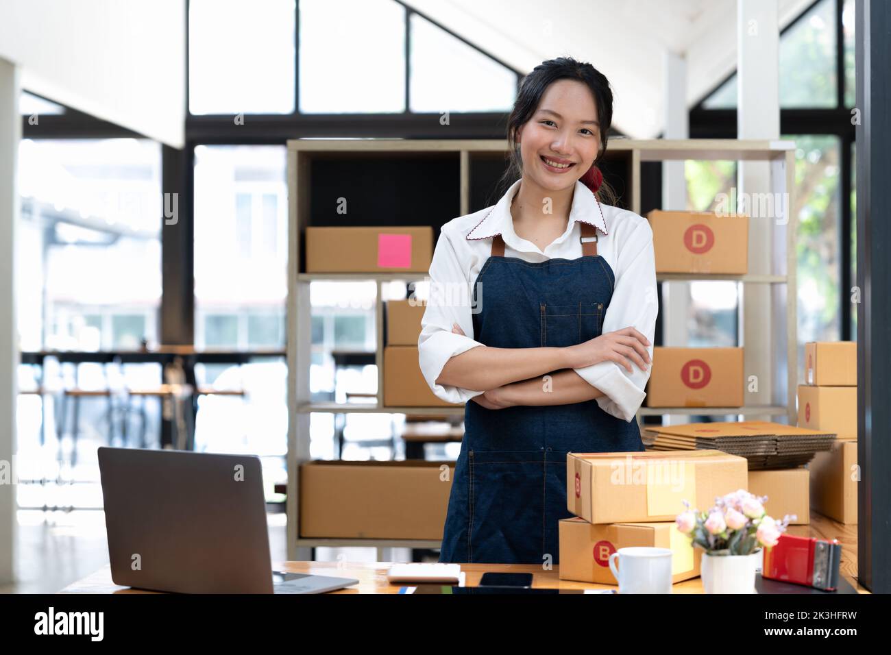 businesswoman start small business and successful SME entrepreneurs A woman works from home delivering parcels online. SME delivery concept and Stock Photo