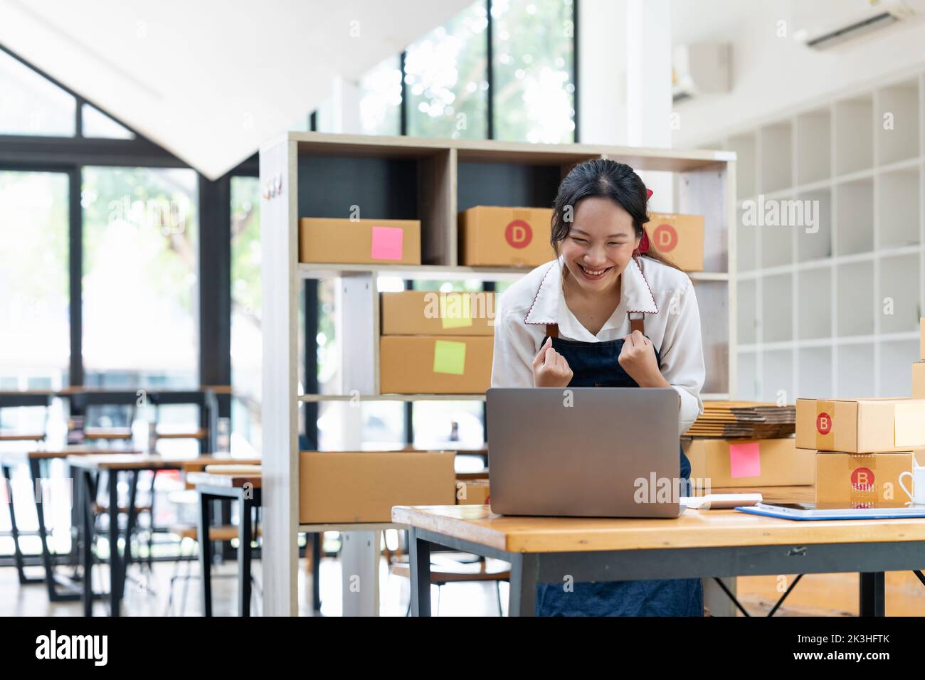 Happy successful SME entrepreneur with arms up, Home office, Business online and delivery, Selling online, Startup small business concept. Stock Photo
