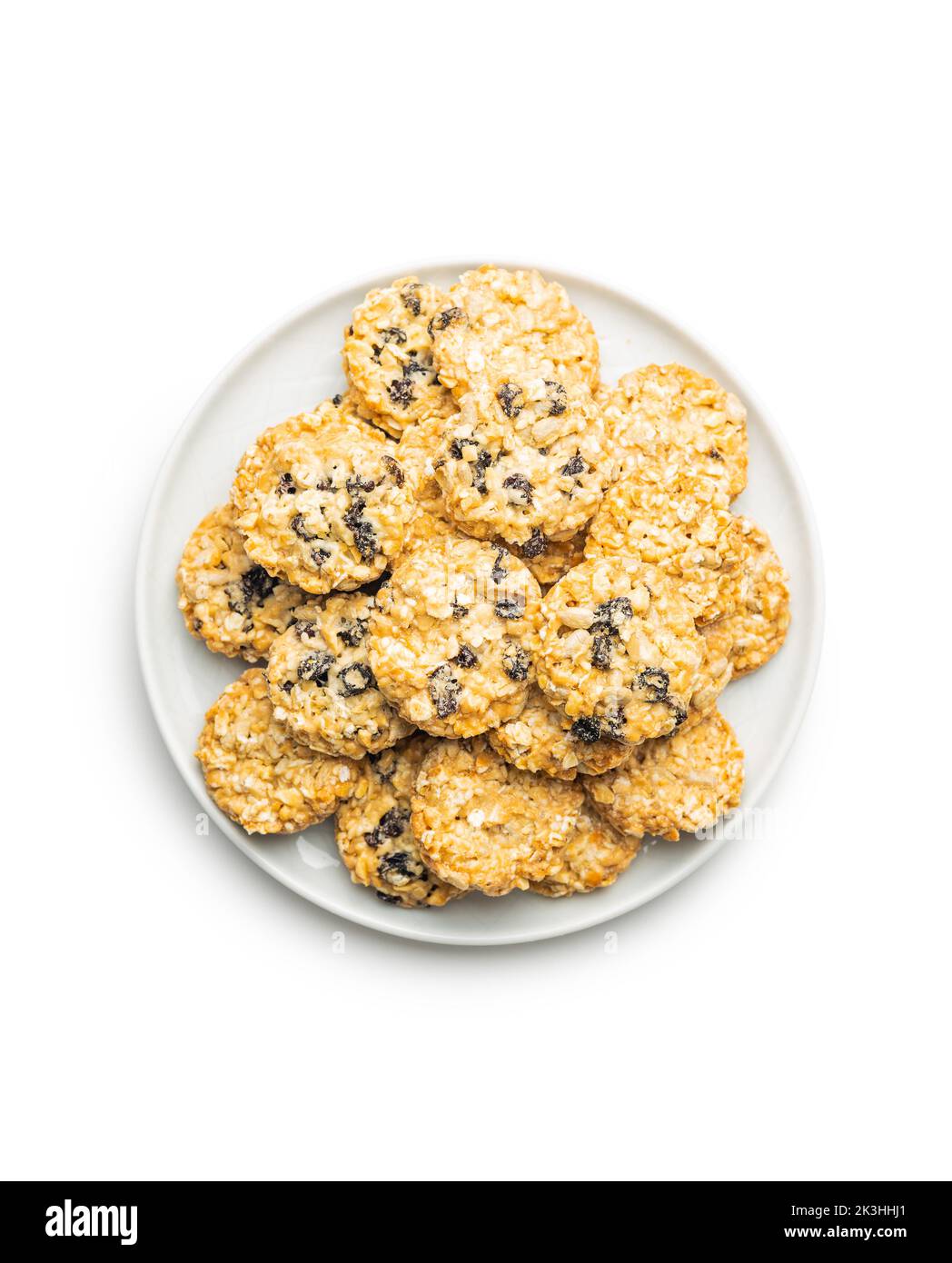 Wholegrain oat cookies. Cookies with oatmeal and raisins isolated on the white table. Stock Photo