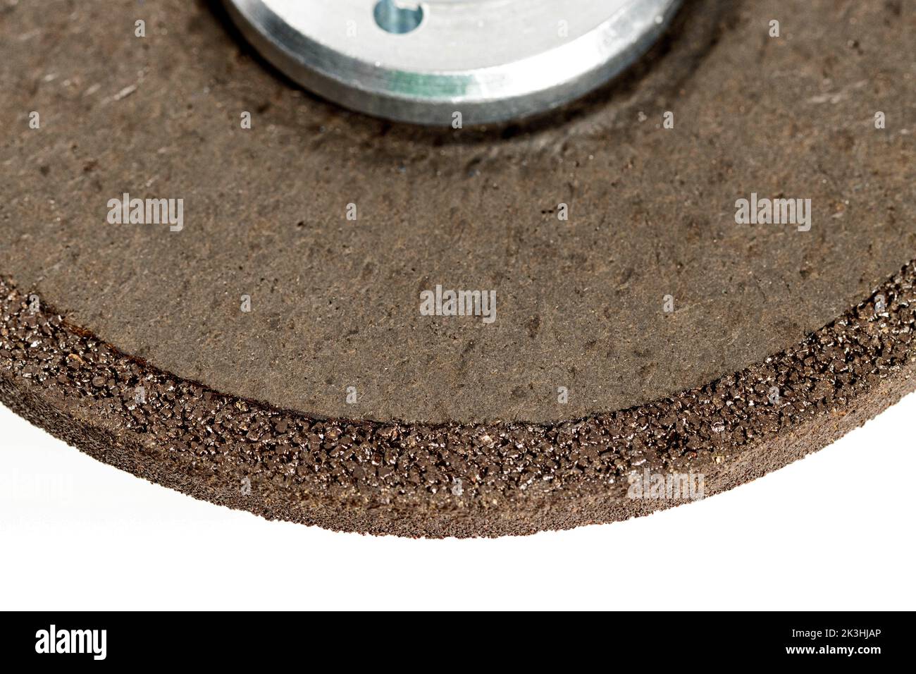 Cleaning reinforced circle on an angle grinder, closeup. Processing