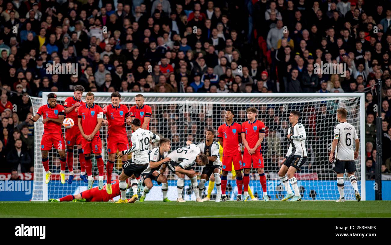 London, UK. 27th Sep, 2022. Leroy Sane of Germany takes a free kick just outside the penalty area to test England during the first half of the Nations League match between England and Germany at Wembley Stadium, London, England on 26 September 2022. Photo by Phil Hutchinson. Editorial use only, license required for commercial use. No use in betting, games or a single club/league/player publications. Credit: UK Sports Pics Ltd/Alamy Live News Stock Photo