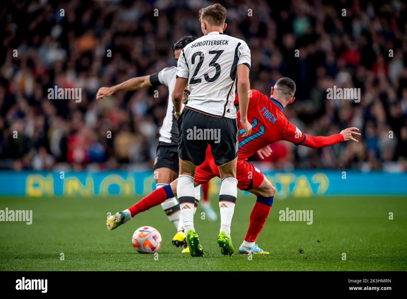 London, UK. 27th Sep, 2022. Phil Foden of England draws the ball between Nico Schlotterbeck and Ilkay Gundogan of Germany during the Nations League match between England and Germany at Wembley Stadium, London, England on 26 September 2022. Photo by Phil Hutchinson. Editorial use only, license required for commercial use. No use in betting, games or a single club/league/player publications. Credit: UK Sports Pics Ltd/Alamy Live News Stock Photo