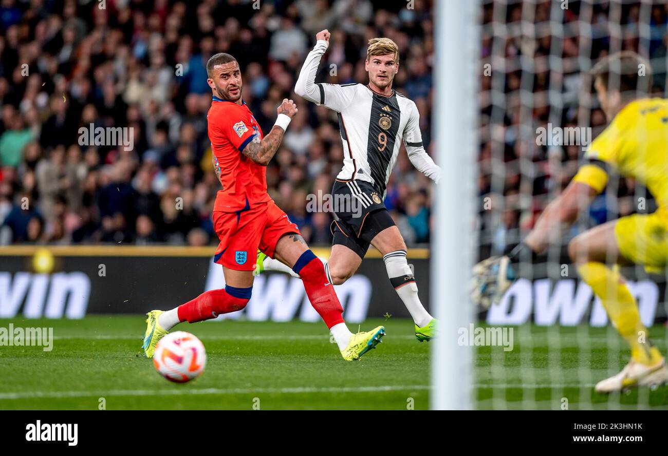 London, UK. 27th Sep, 2022. Timo Werner of Germany shoots and sees his shot pass the far post as Kyle Walker of England challenges during the Nations League match between England and Germany at Wembley Stadium, London, England on 26 September 2022. Photo by Phil Hutchinson. Editorial use only, license required for commercial use. No use in betting, games or a single club/league/player publications. Credit: UK Sports Pics Ltd/Alamy Live News Stock Photo