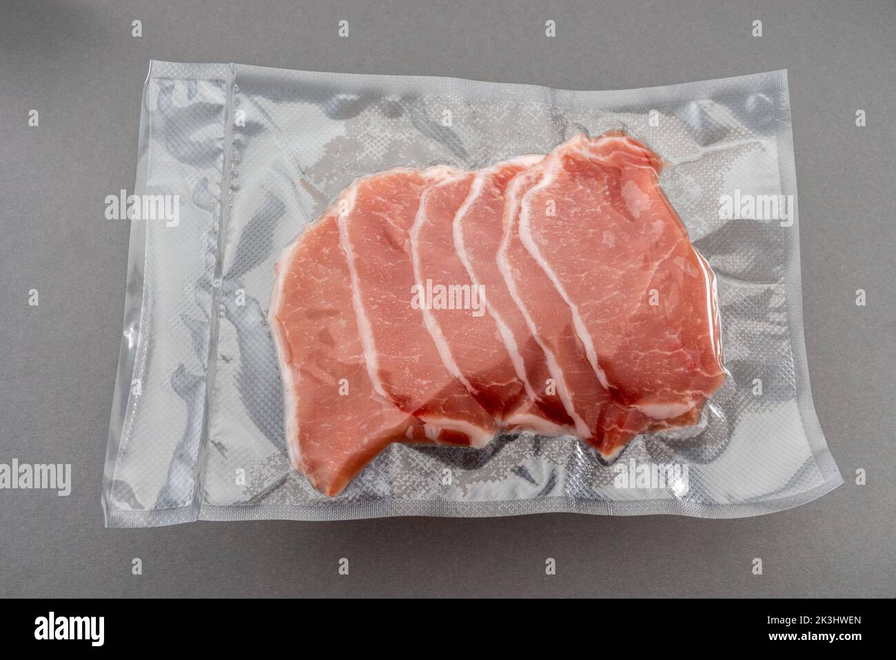 Pork loin slices in vacuum packed sealed for sous vide cooking isolated
