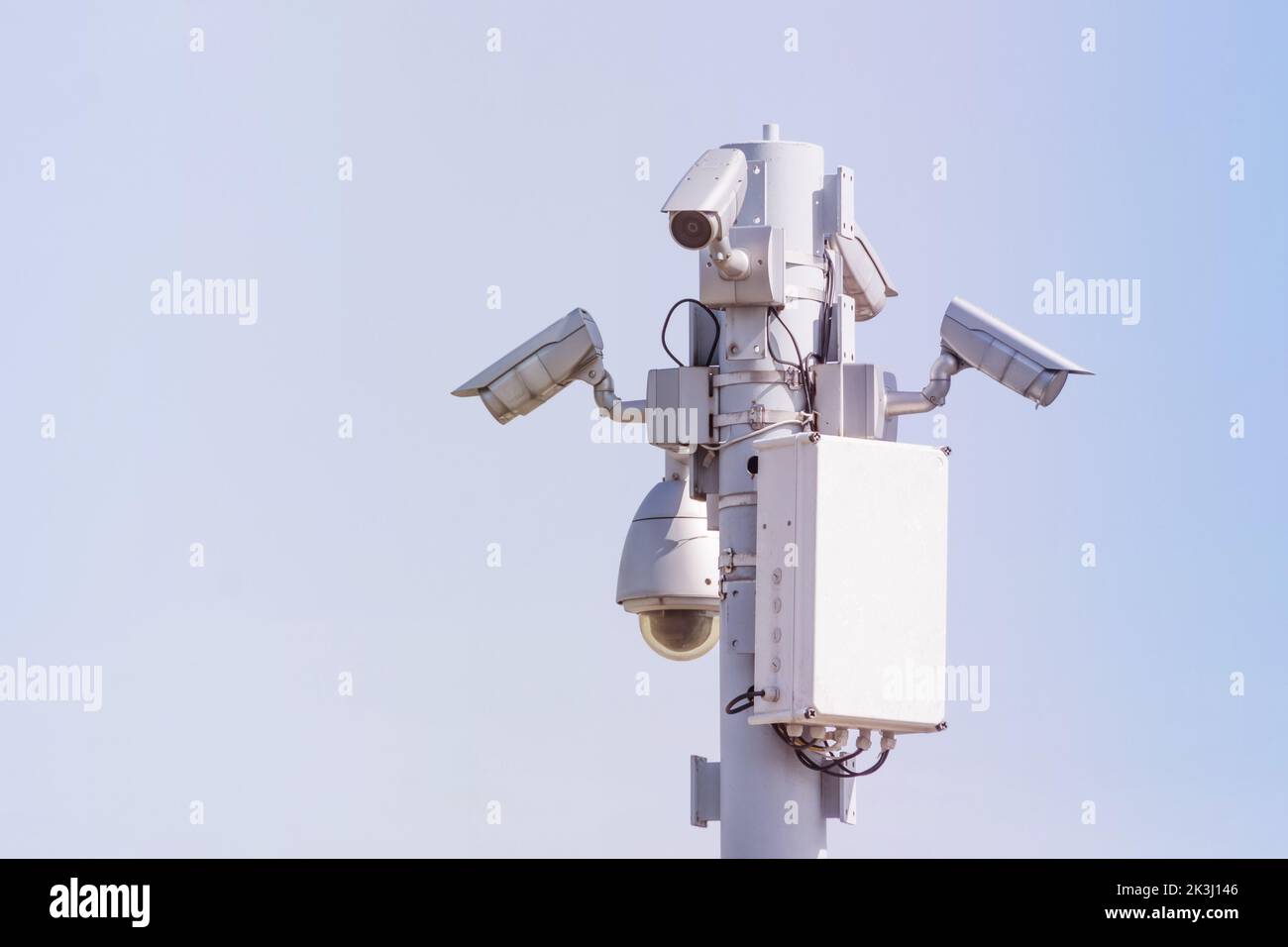 Public security cameras, capture the townspeople. White cameras are mounted on a metal pole Stock Photo