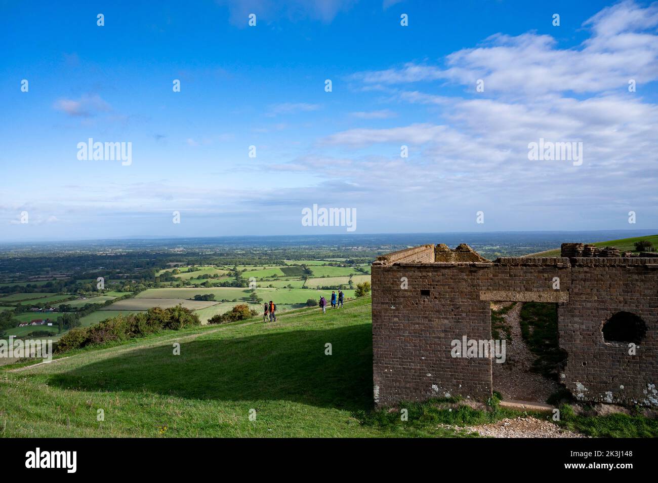 Brighton UK 27th September 2022 - Walkers enjoy a sunny but chilly Autumn morning along the South Downs Way at Devils Dyke just north of Brighton  . : Credit Simon Dack / Alamy Live News Stock Photo