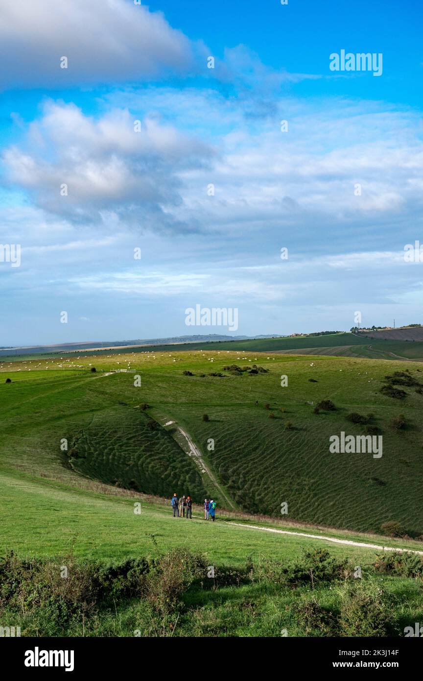 Brighton UK 27th September 2022 - Walkers enjoy a sunny but chilly Autumn morning along the South Downs Way at Devils Dyke just north of Brighton  . : Credit Simon Dack / Alamy Live News Stock Photo