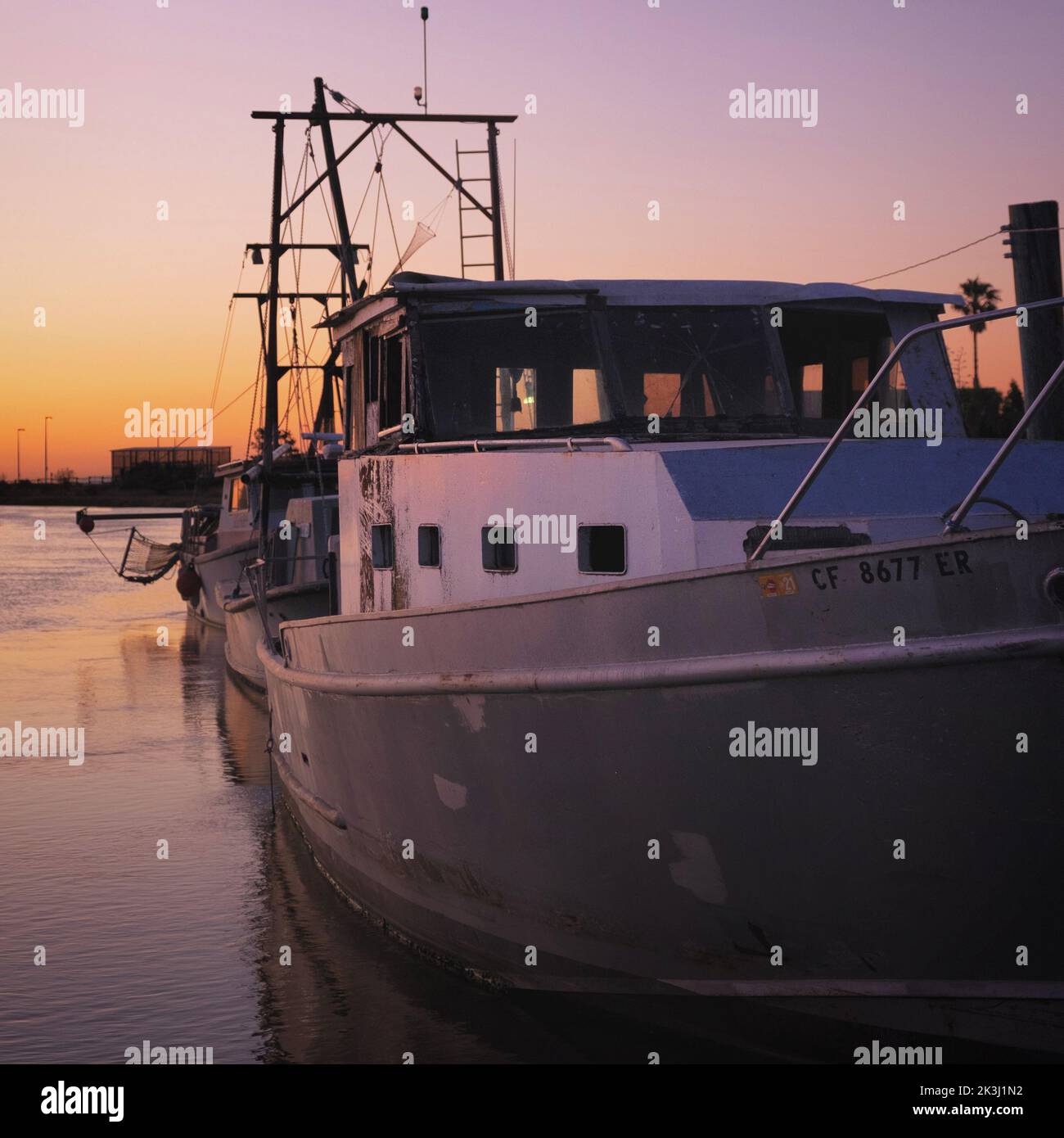 A boat at the harbor during sunset in Alviso, San Jose, California, United States Stock Photo