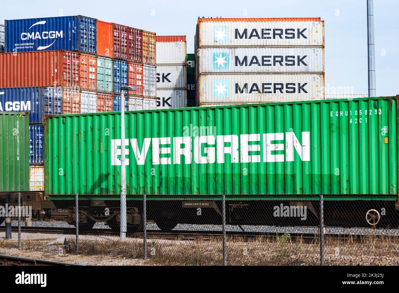 Evergreen shipping container leaving the port of Felixstowe by rail Stock Photo