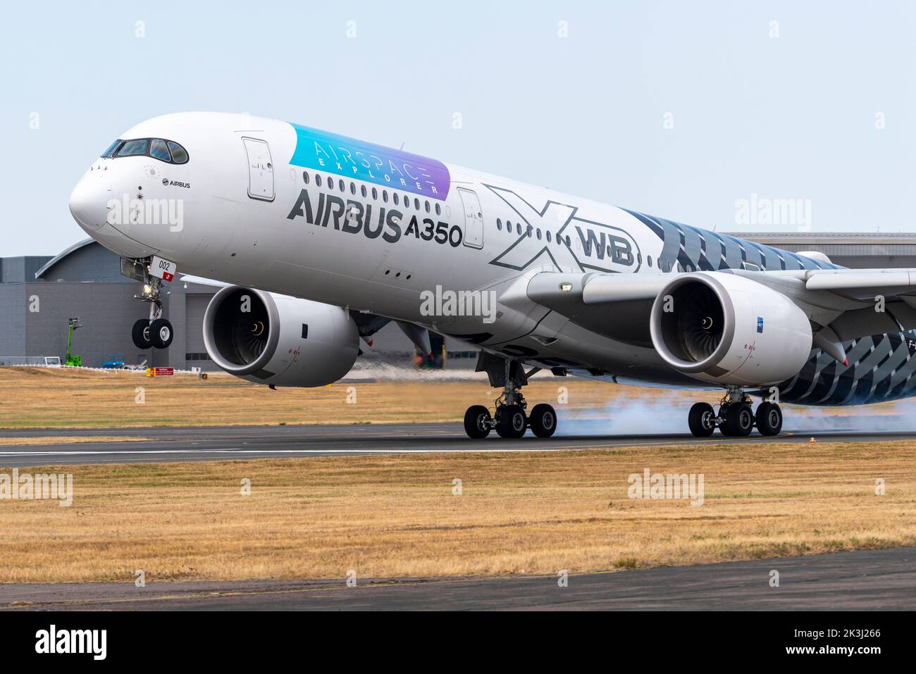 Airbus A350 airliner jet plane landing after display at the Farnborough International Airshow 2022. A350 900 test aircraft touching down after display Stock Photo