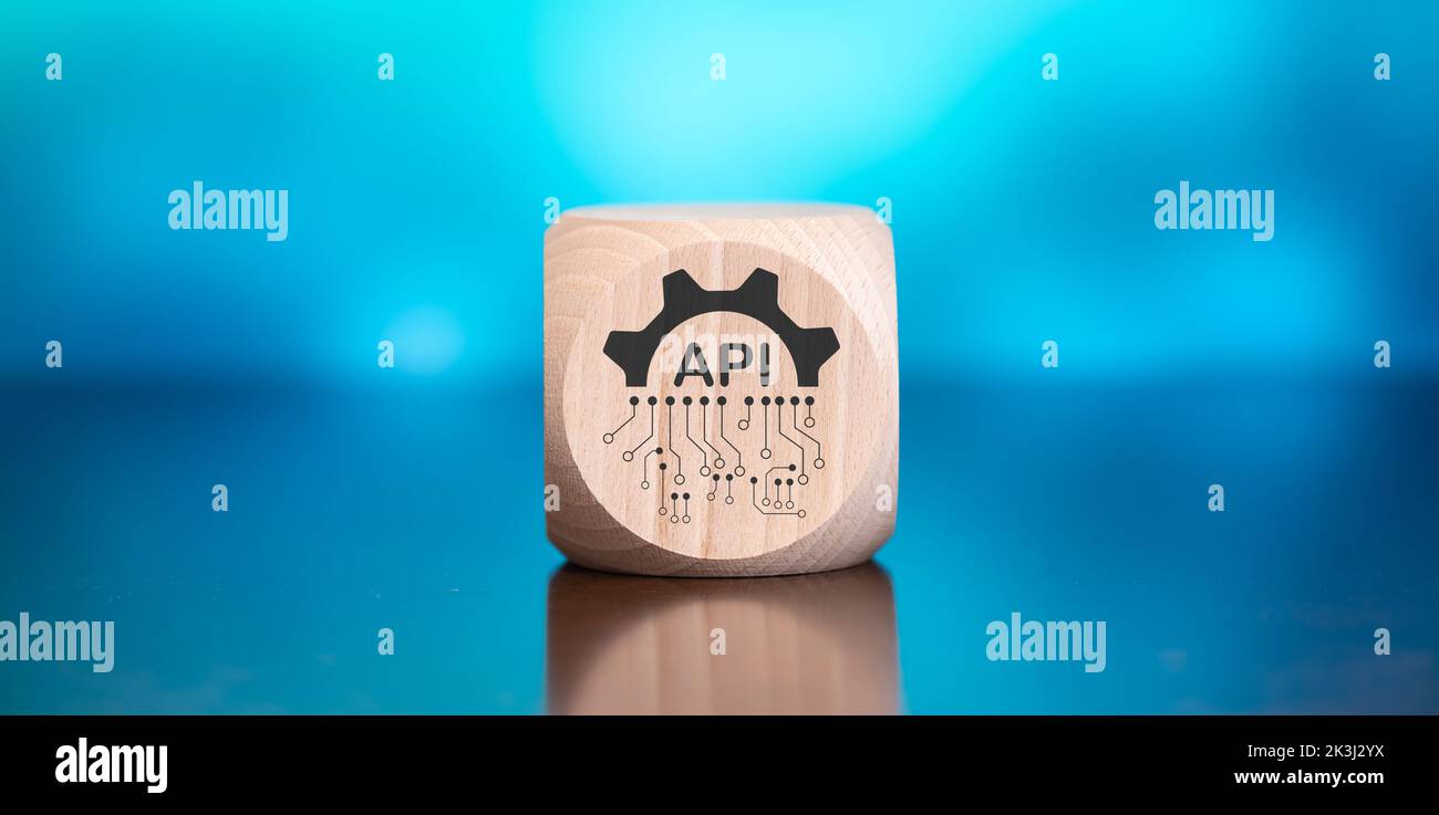 Wooden block with symbol of api concept on blue background Stock Photo ...