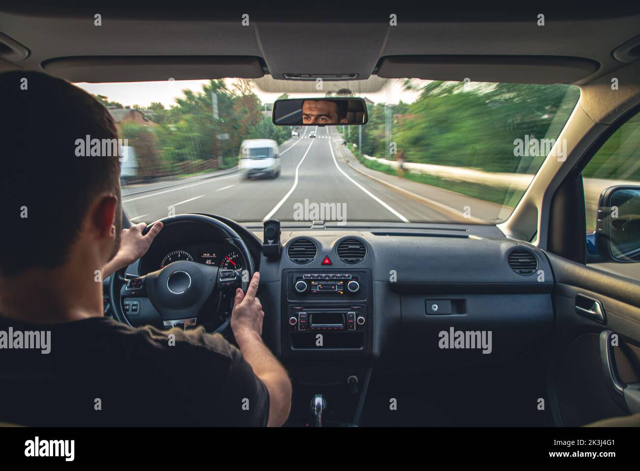 Hands on the wheel when driving at high speed from inside the car Stock
