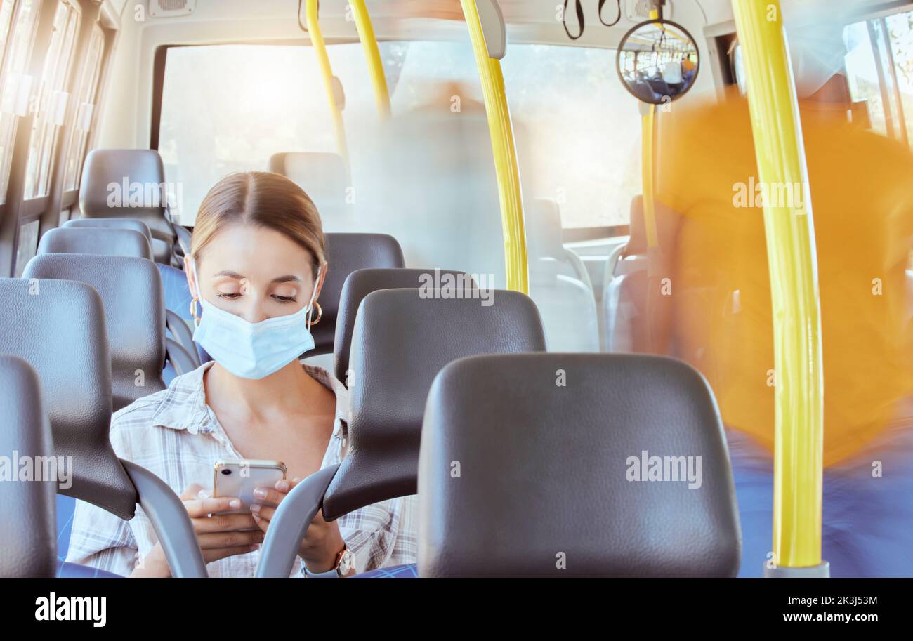 Bus travel, covid woman and phone typing for social media, reading notification and 5g online mobile tech in transport journey. Young girl face mask Stock Photo