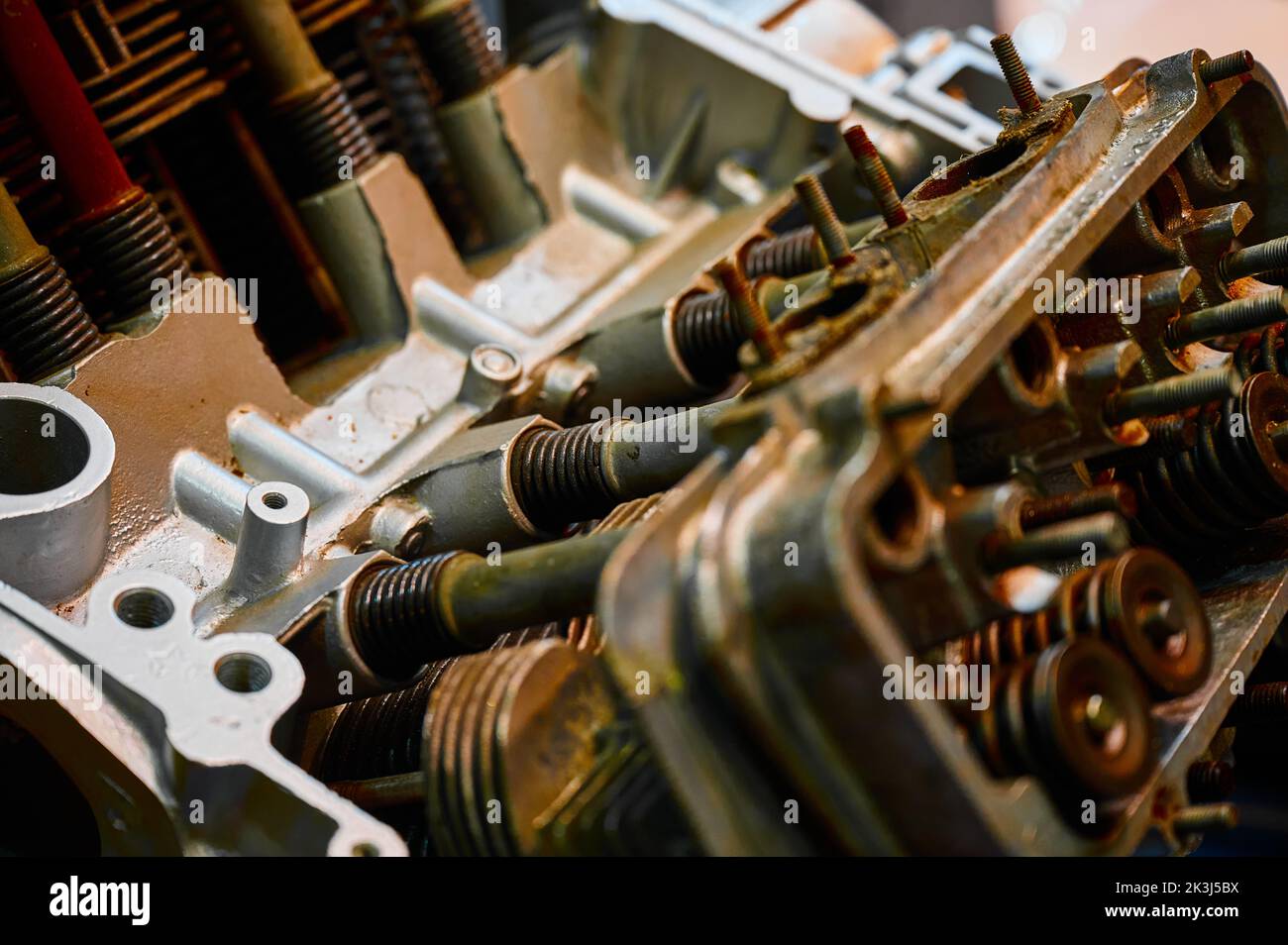 Old internal combustion engine of car with rust in workshop Stock Photo