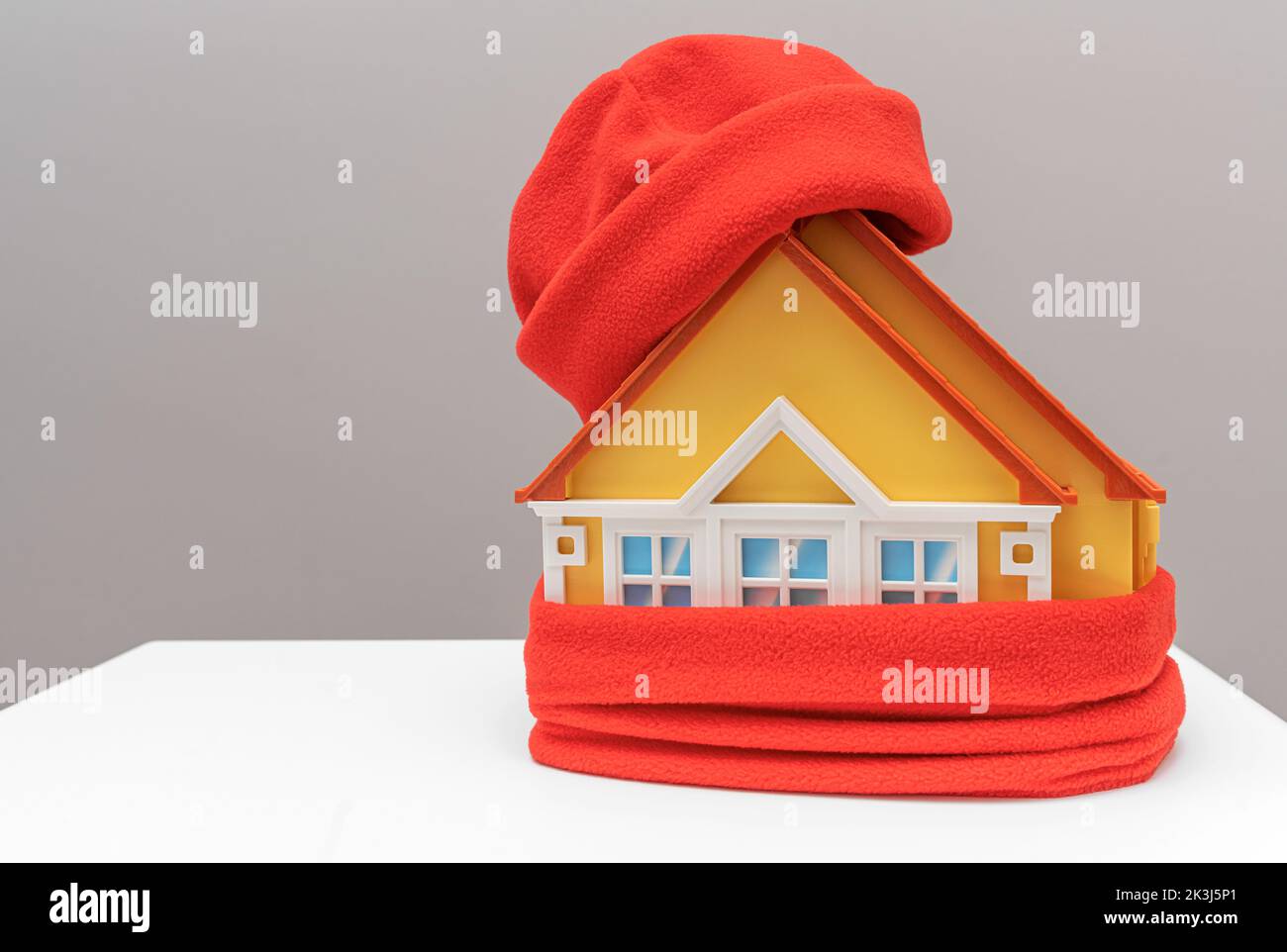 The house is wrapped in a warm scarf. Stock Photo