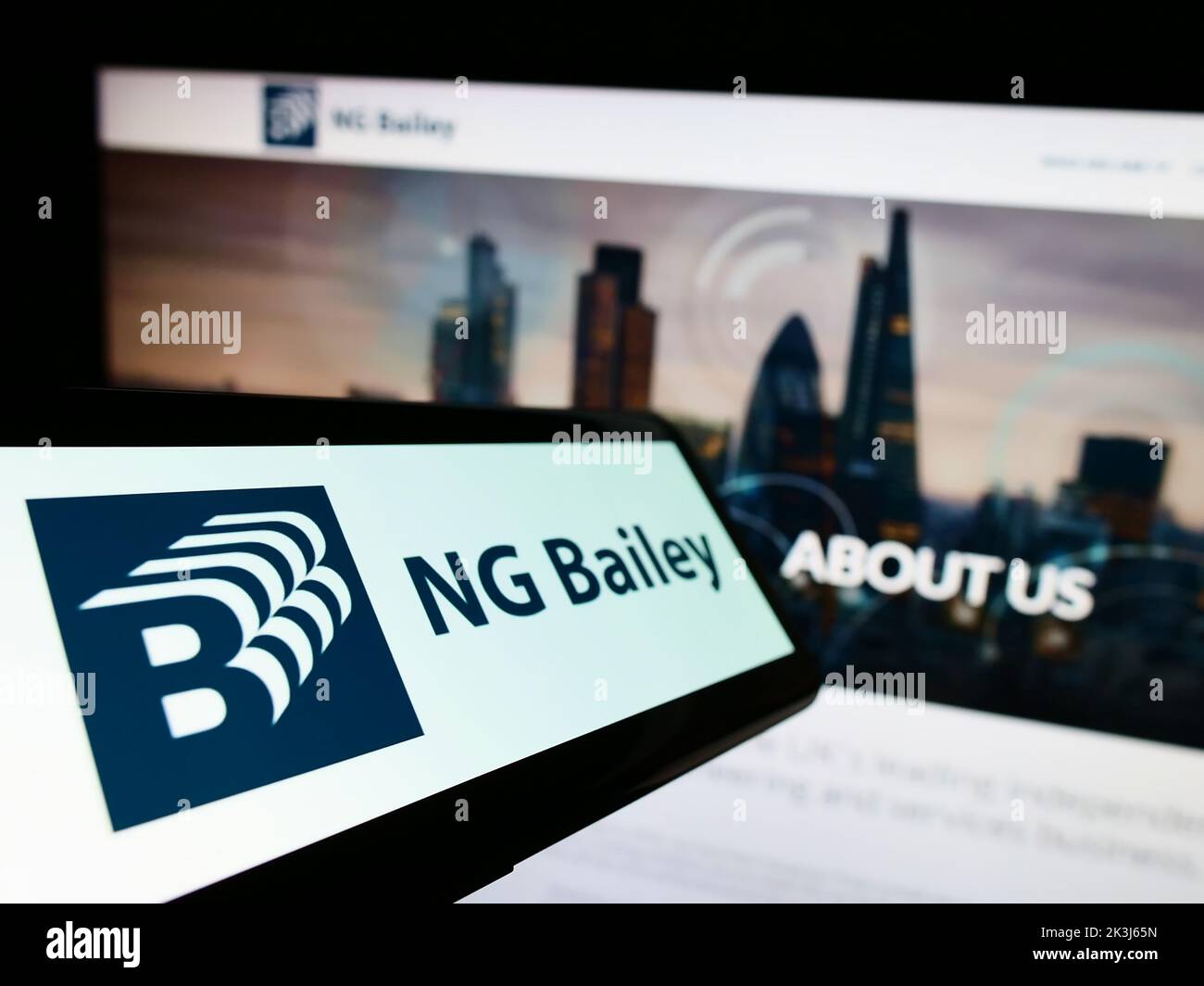 Smartphone with logo of engineering company NG Bailey Group Limited on screen in front of business website. Focus on center-left of phone display. Stock Photo