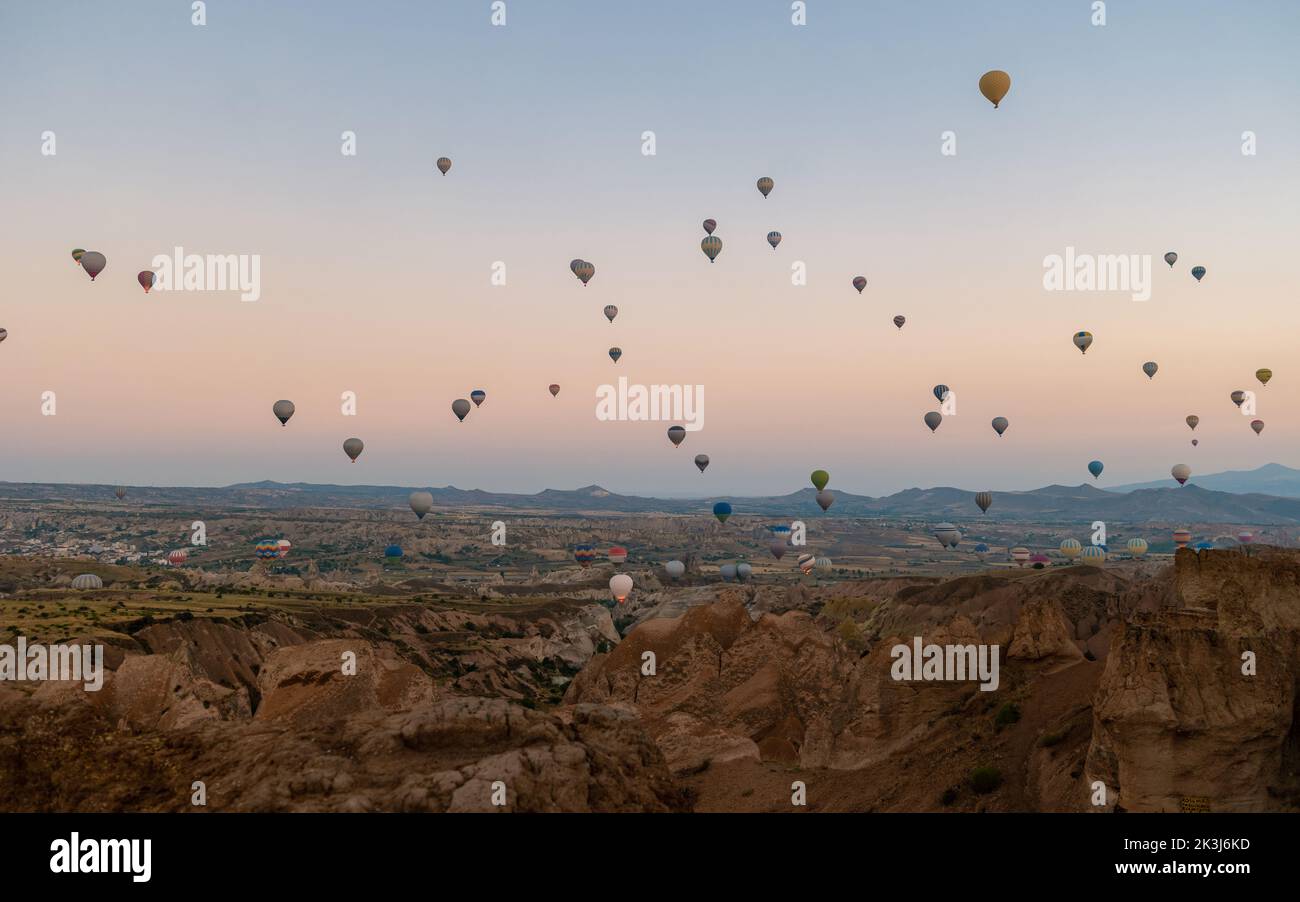 Sunrise with hot air balloons in Cappadocia, Turkey balloons in Cappadocia Goreme Kapadokya, and Sunrise in the mountains of Cappadocia with many hot air ballon in the sky Stock Photo