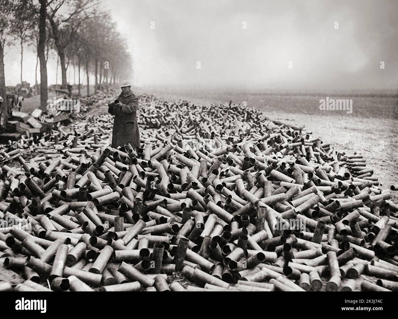Masses of shell cases on a French roadside near the front lines, the contents of which had been fired into the German lines. Officially the British fired around 175 million rounds throughout the war, likewise the French, Germans and Austrians matching the number. Collectively it's estimated about a billion rounds were fired during the war. Stock Photo