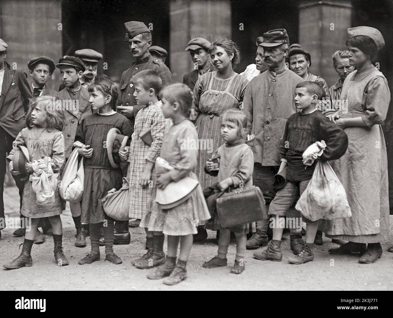 Group of refugee children received by a French organization, aided by the American Red Cross at St. Sulpice, Paris. They are about to start for Grand Val, the country home which has been opened for them on a large estate near Paris, where an outdoor life will build up their health. August, 1918. Stock Photo