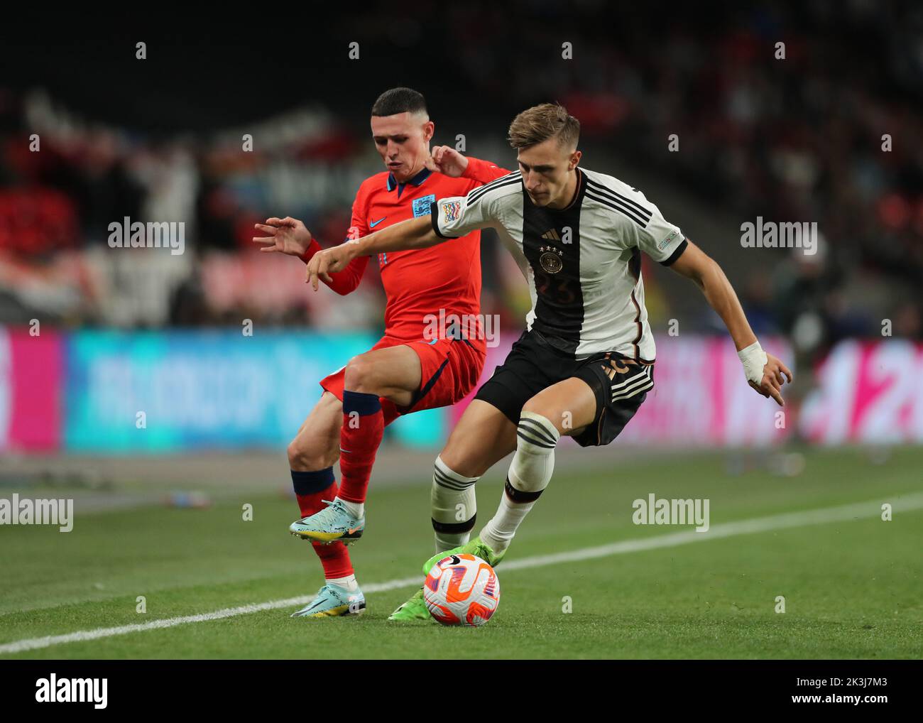 London, UK. 26th September 2022; Wembley Stadium, London, England:  UEFA Nations League football, England versus Germany; Phil Foden of England challenges Nico Schlotterbeck of Germany Credit: Action Plus Sports Images/Alamy Live News Stock Photo