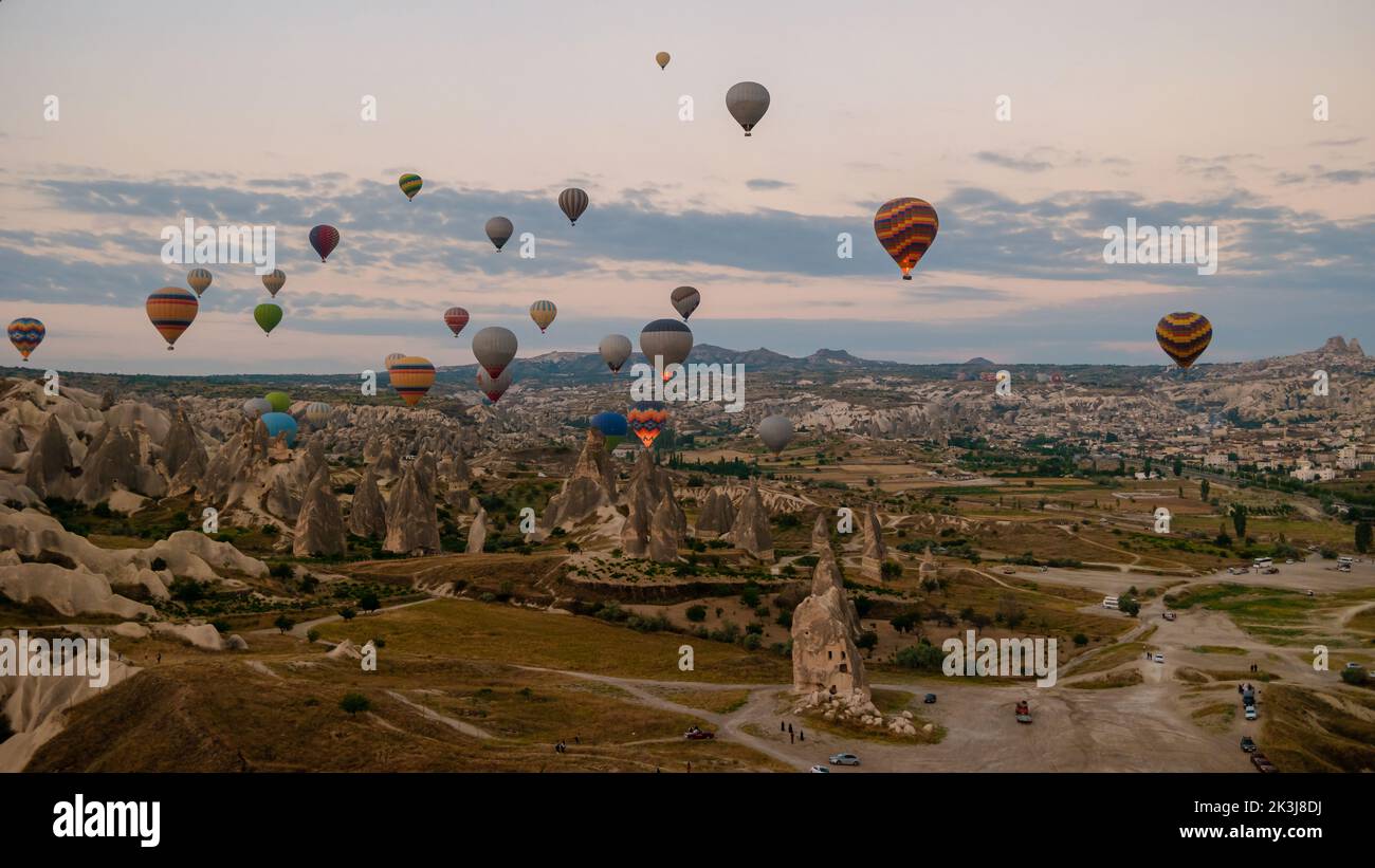 Sunrise with hot air balloons in Cappadocia, Turkey balloons in Cappadocia Goreme Kapadokya, and Sunrise in the mountains of Cappadocia with many hot air ballon in the sky Stock Photo