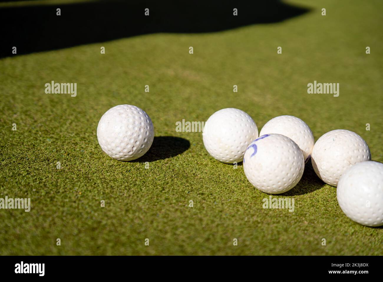 Field Hockey Balls on a Green Pitch Stock Photo Alamy