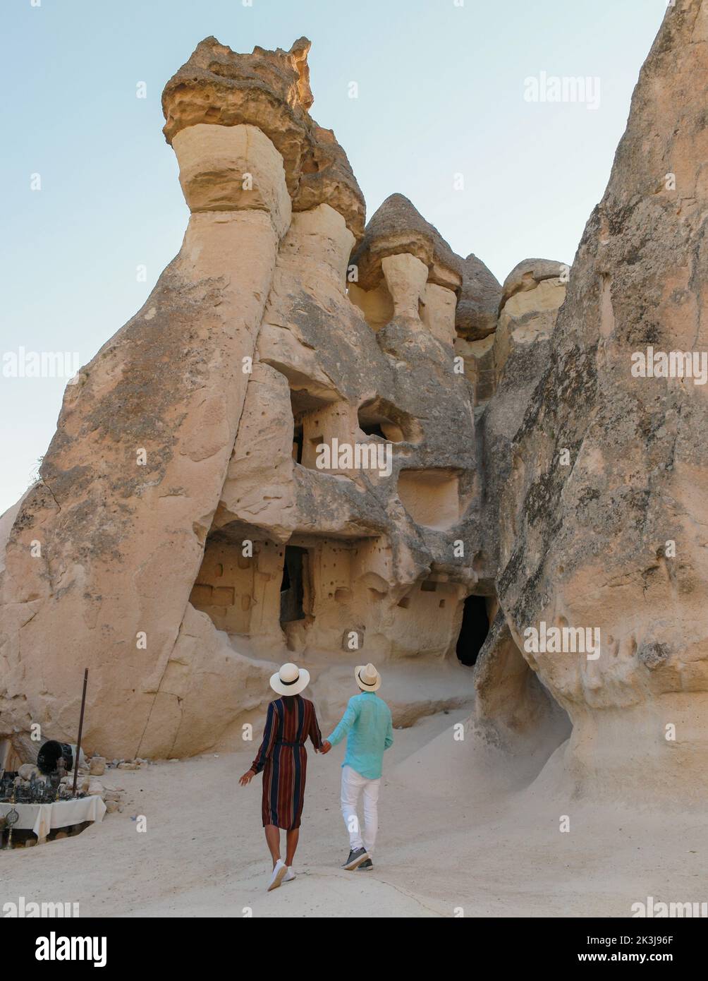 Pasabag Monks Valley happy young couple on vacation in Turkey Cappadocia, Rock Formations in Pasabag Monks Valley, Cappadocia, Turkey.  Stock Photo