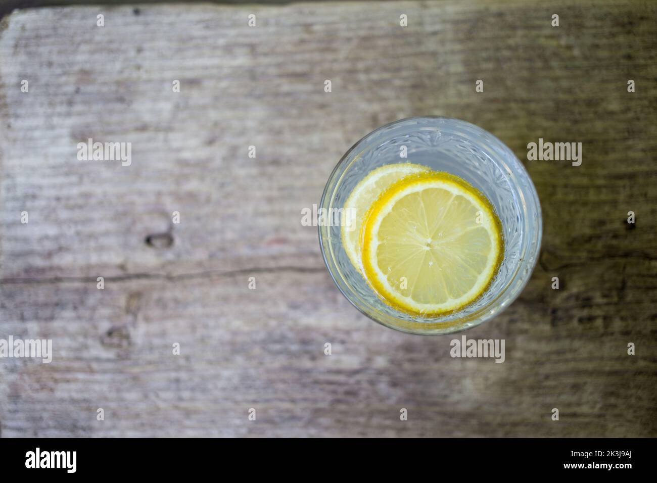 A top view of a Gin and Tonic on wooden background Stock Photo