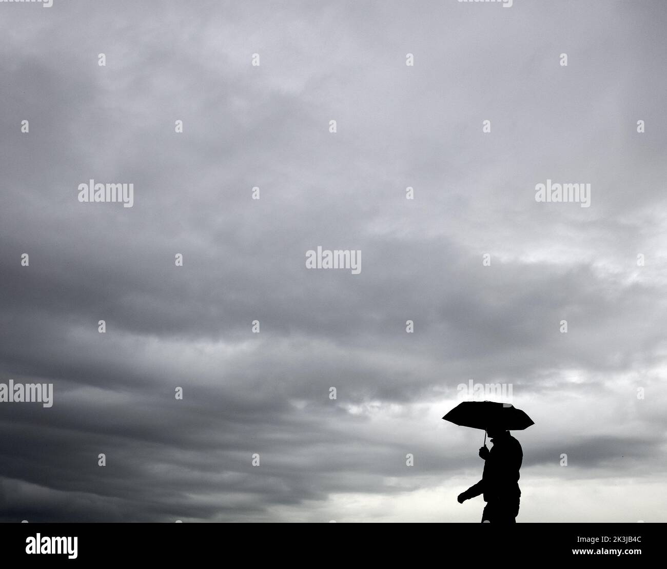 2022-09-27 13:03:04 AMSTERDAM - A gentleman defies the rain. The summer ...