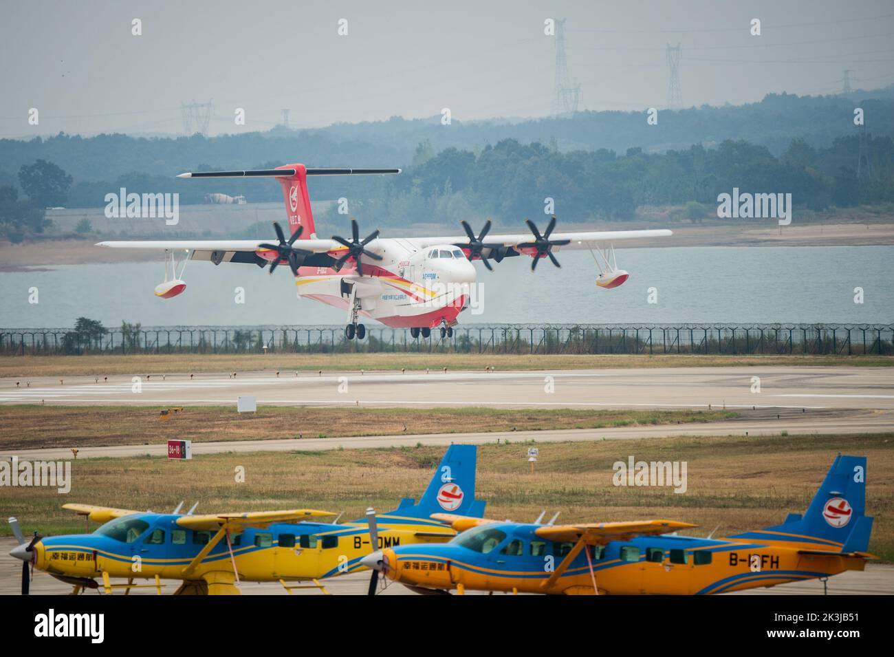 (220927) -- JINGMEN, Sept. 27, 2022 (Xinhua) -- An AG600M firefighting aircraft lands at Zhanghe Airport during a gathering and dropping water test in Jingmen, central China's Hubei Province, Sept. 27, 2022. Codenamed Kunlong, the AG600 large amphibious aircraft family is seen as key aeronautical equipment for China's emergency-rescue system. It was developed by the Aviation Industry Corporation of China (AVIC), the country's leading plane-maker, to meet the needs of firefighting and marine-rescue missions, as well as other critical emergency-rescue operations. (Xinhua/Wu Zhizun) Stock Photo