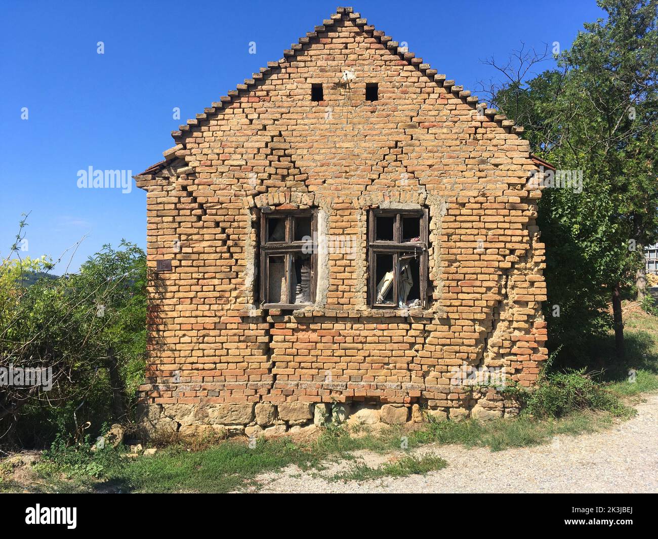 an abandoned village house surrounded with greenery Stock Photo Alamy