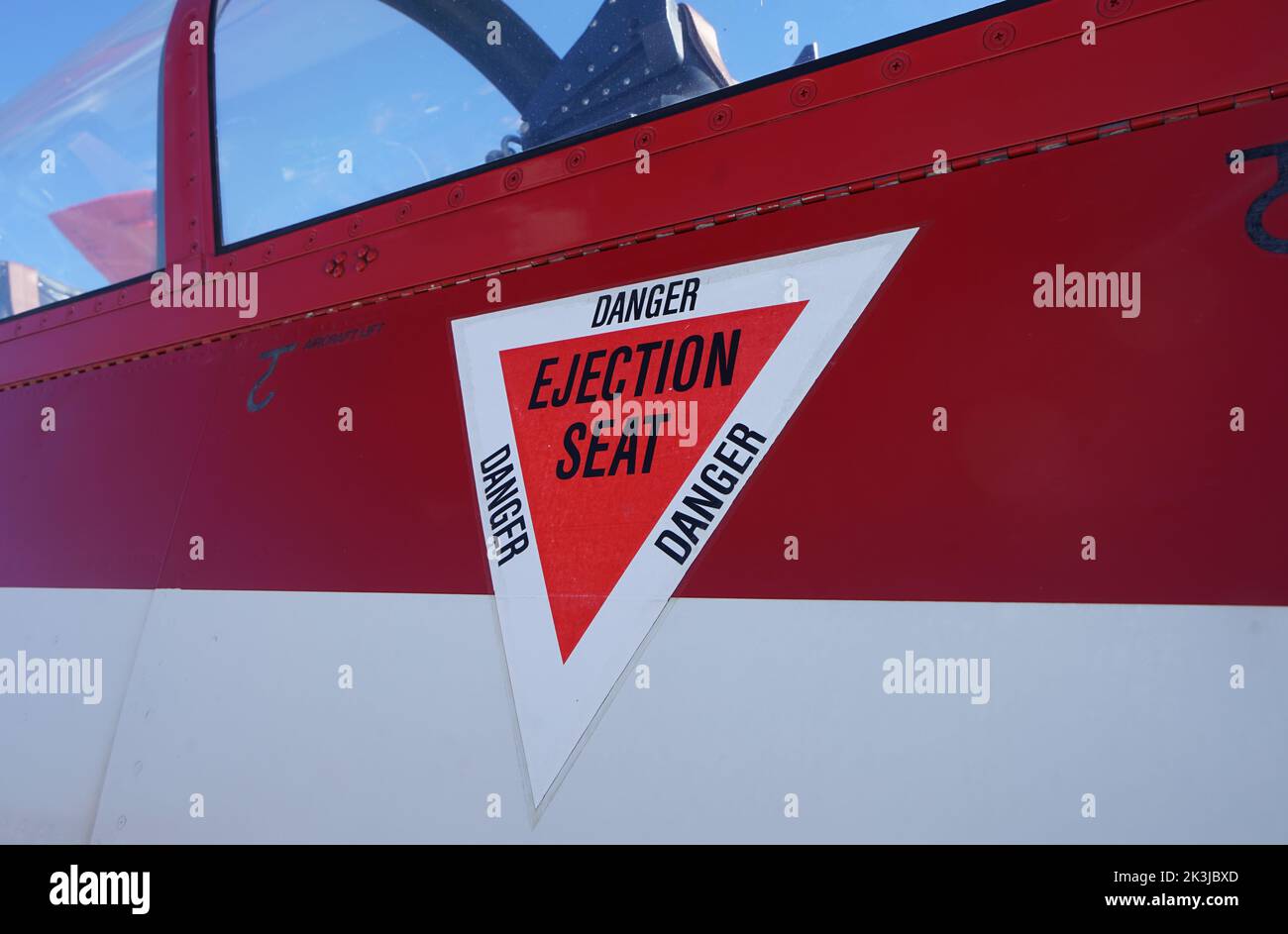 Ejection seat warning label on airplane. Stock Photo